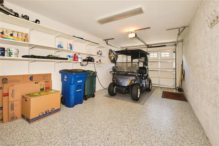 Garage featuring a garage door opener