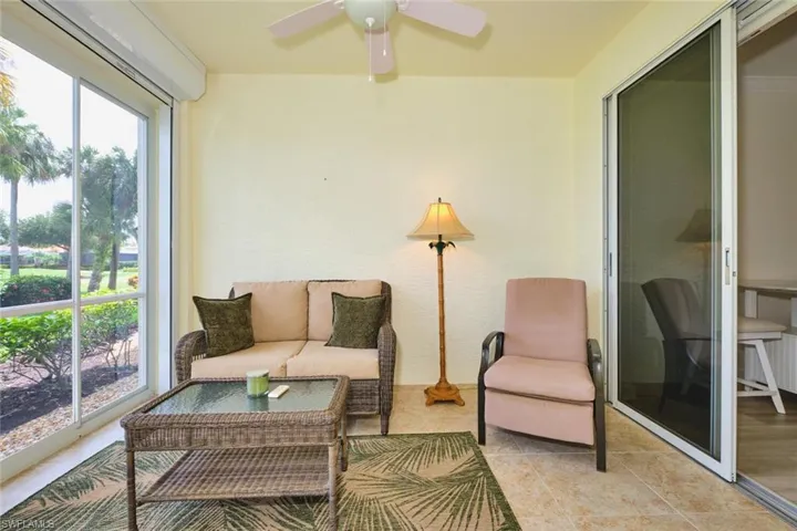 Sunroom / solarium with ceiling fan and an outdoor hangout area