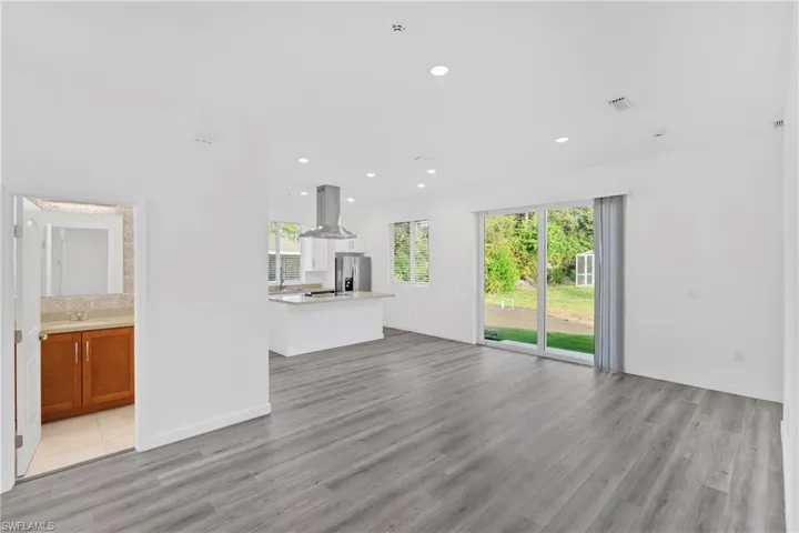 Unfurnished living room featuring recessed lighting and light wood-type flooring