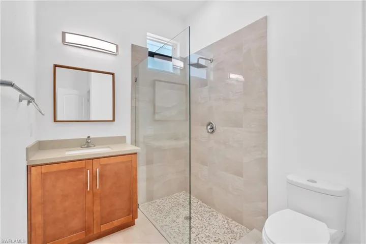 Full bath with vanity and a walk in shower