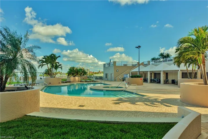 View of pool featuring a patio area and an in ground hot tub