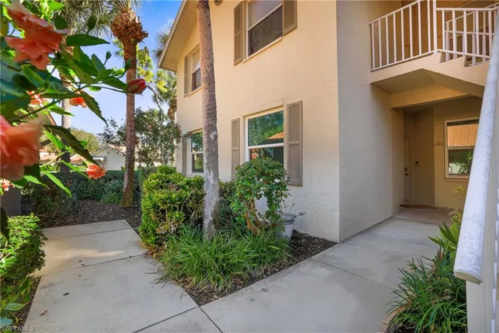 View of side of property featuring stucco siding
