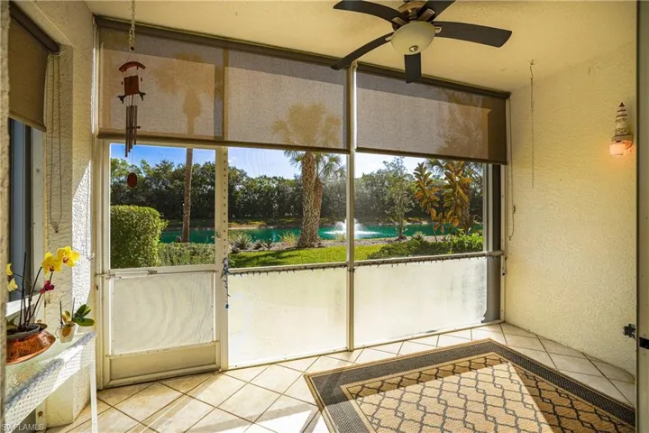 Unfurnished sunroom featuring a water view
