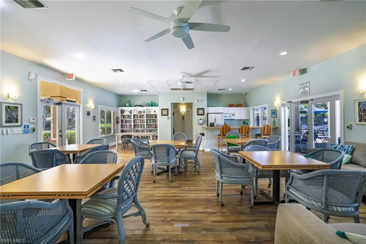 Dining area with french doors, hardwood / wood-style flooring, recessed lighting, and a ceiling fan
