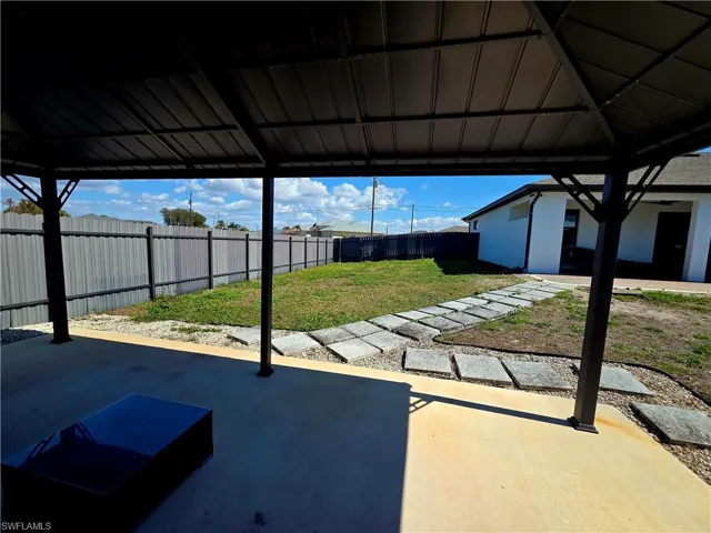 Fenced backyard featuring a patio area