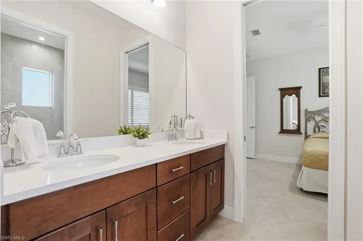 2nd Bathroom connected t o 2nd & 2rd bedrooms featuring double vanity and private water closet and shower