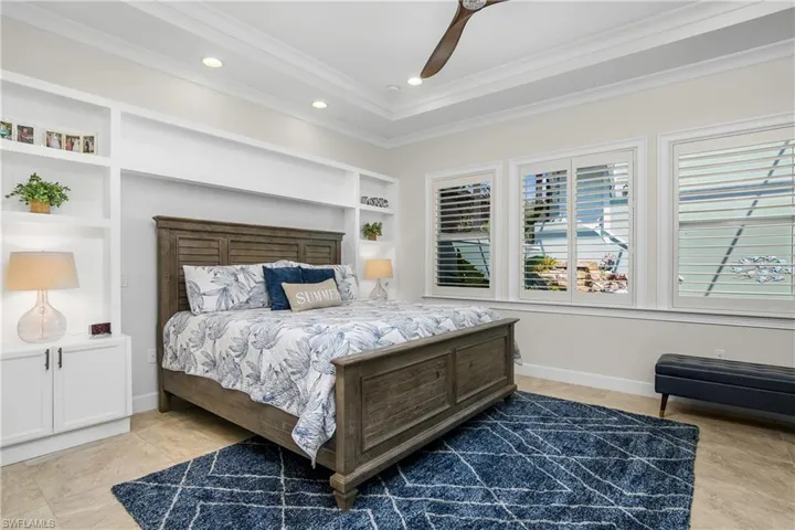 Stunning first floor master suite with tile flooring, molding, built in cabinetry, plantation shutters. Two large walk-in closets, elegant master bath with double vanities.