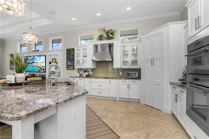 Notice the transom windows above! Double tray ceilings range from 12 to 14 feet.