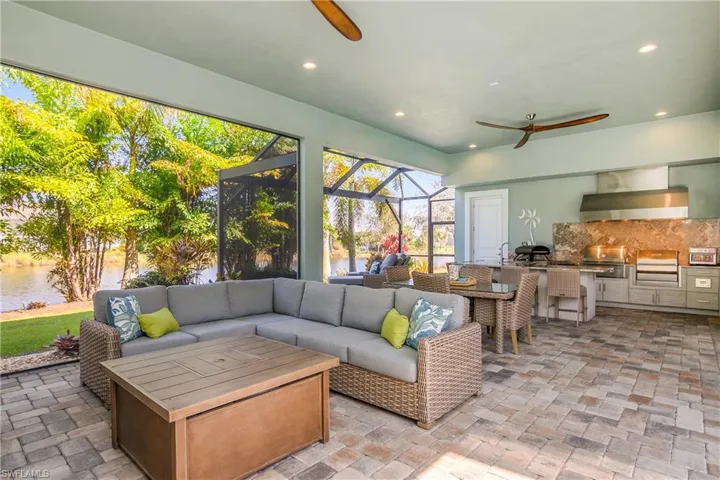 Outdoor cooking and dining on one side, lounging space on the other side.