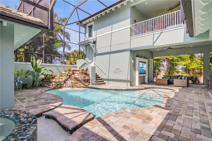 Another shot of the pool, waterfall and abundant outdoor living space!