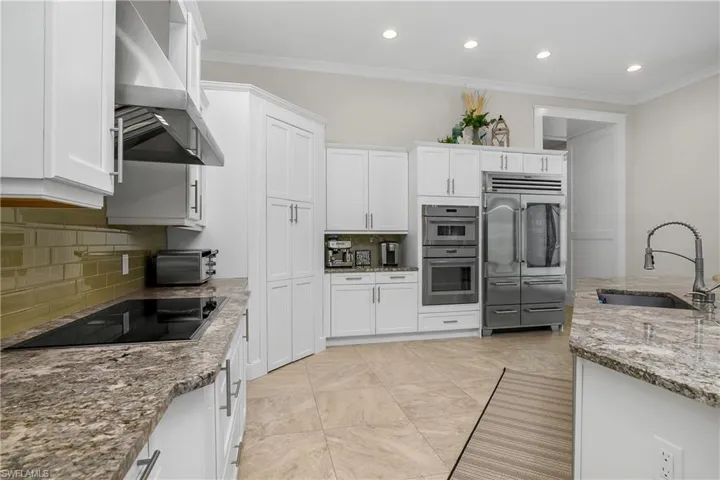 Another view of the kitchen. Sub Zero fridge, Thermador, Bosch Dishwasher, Large Pantry.