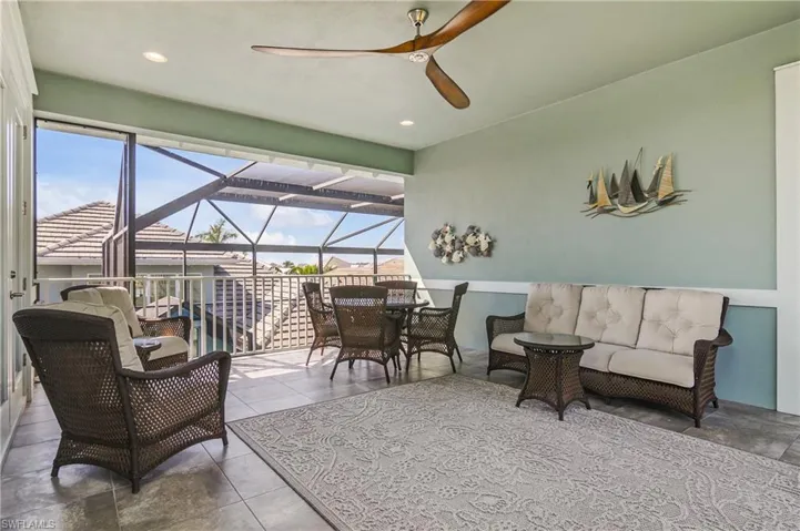 Second floor balcony offers views of water on one side and the pool on the other! This balcony connects with the second floor bedroom, all in all makes a great spot for family and guests.