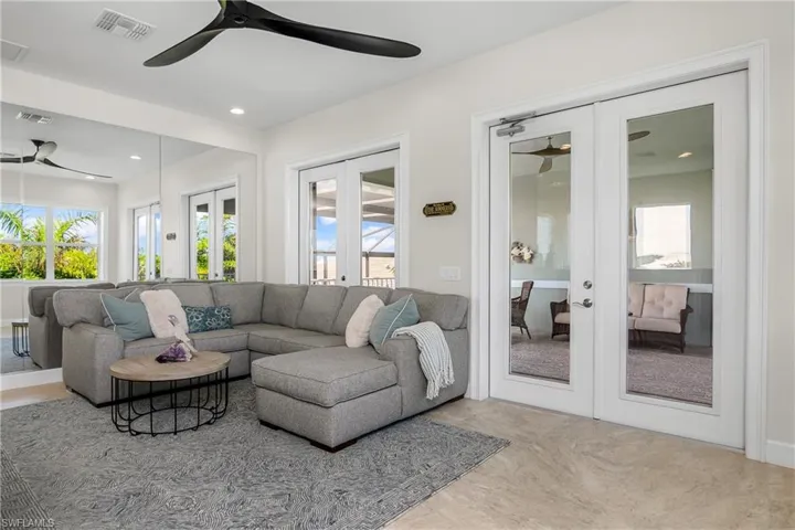 Recreation room with french doors that lead out to the second floor balcony, and second floor casita bedroom.