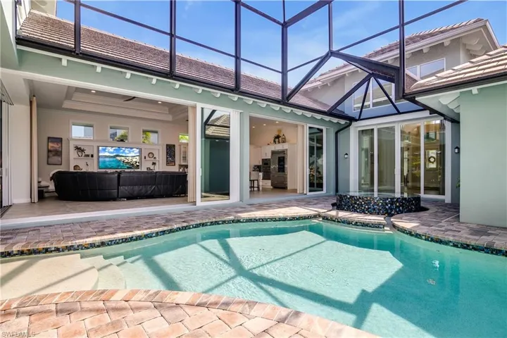 Close up shot of the opened pocket doors. A perfect setup spending "winter" in Naples Florida!
