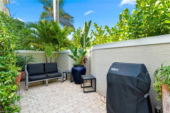 View of patio / terrace with area for grilling, a fenced backyard, and an outdoor living space