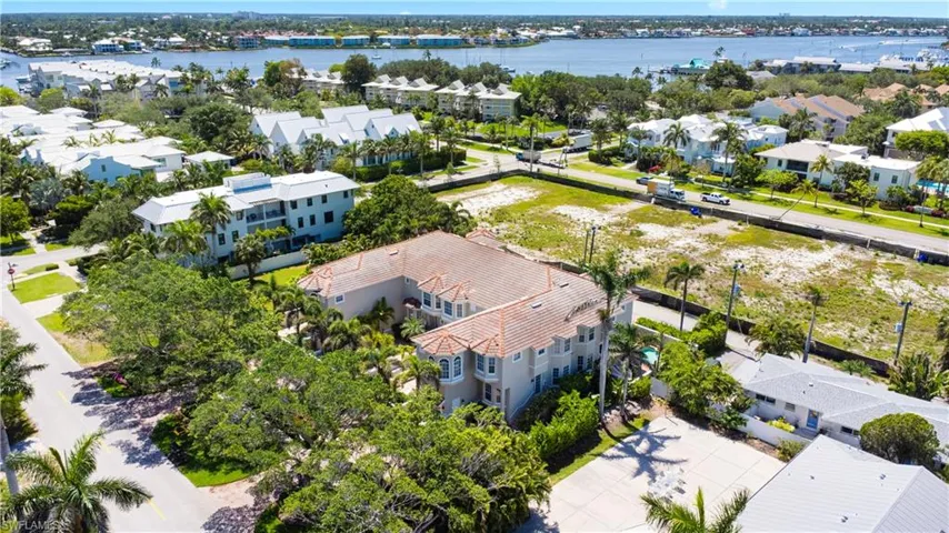 Aerial perspective of suburban area with a nearby body of water