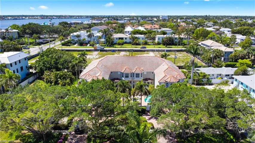 Aerial perspective of suburban area with a nearby body of water