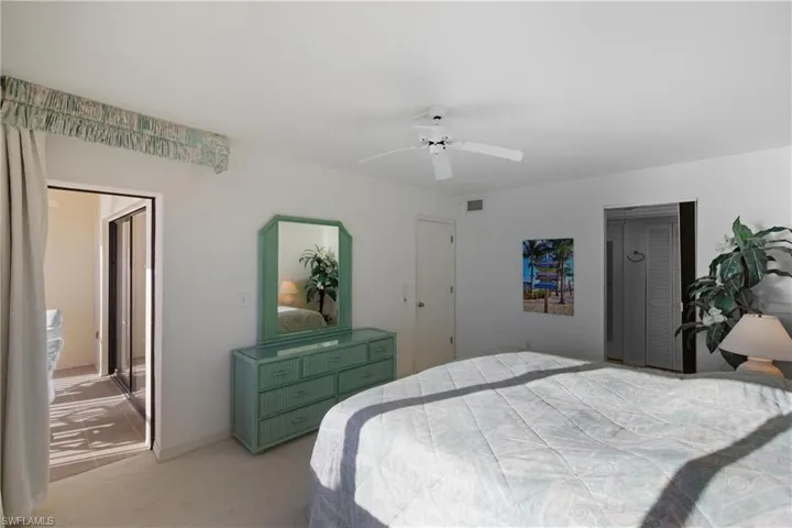 Primary bedroom with glass door out to lanai