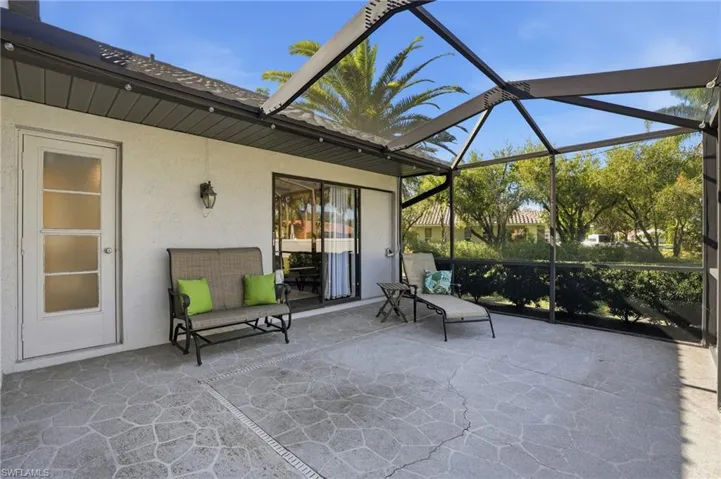 View of patio featuring a lanai and a sunroom