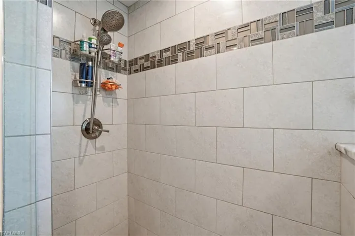 Bathroom view of a tile shower