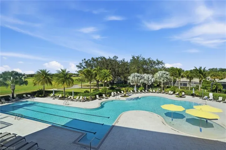 Community pool featuring a patio