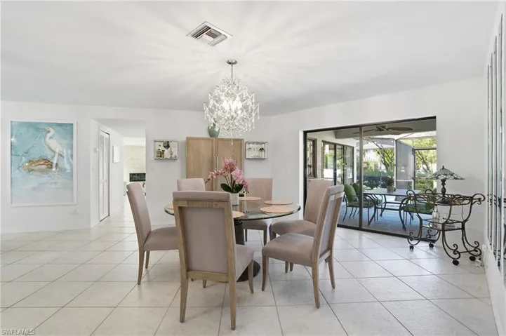 Dining space featuring a chandelier and light tile patterned floors