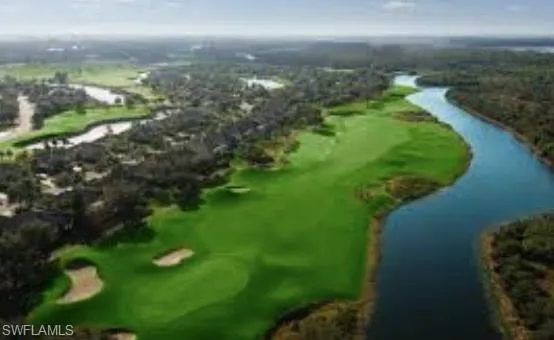 Aerial view of a golf club and a nearby body of water