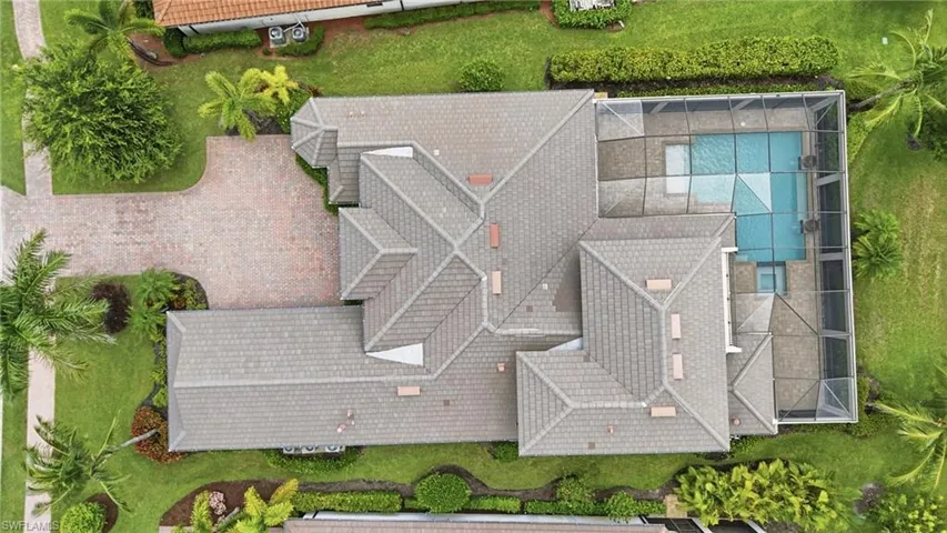 Expansive residential property featuring a multi-gabled tile roof