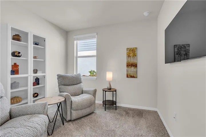1st Bedroom /Sitting room with carpet flooring