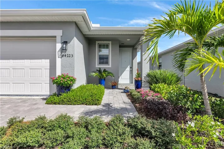 Property entrance with stucco siding.