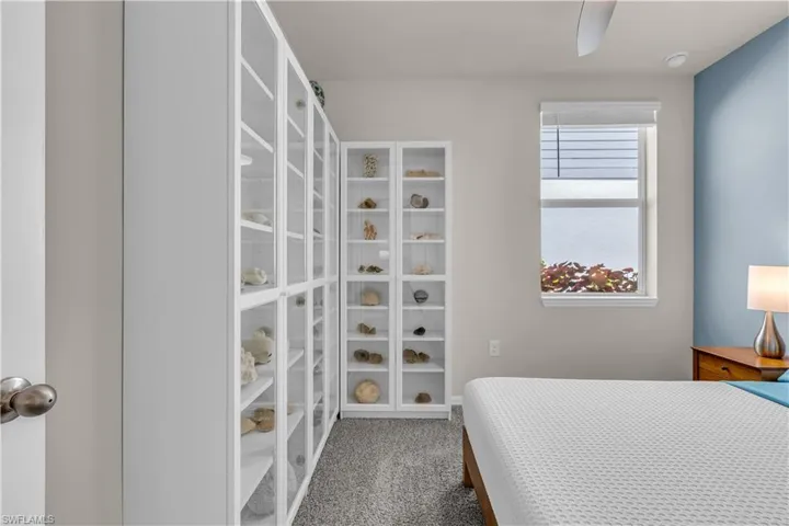 Guest Bedroom with carpet flooring and ceiling fan