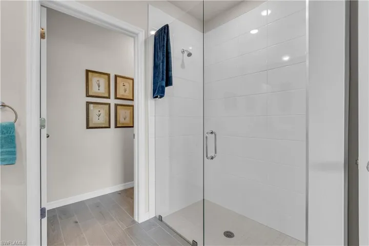 Master full bathroom with a walk in frameless shower and Ceramic tile floors