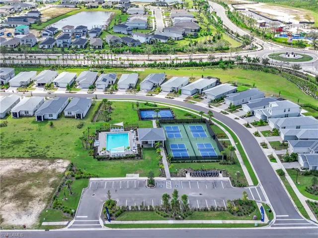 Aerial view of Community Amenity Center.  4 Pickleball courts, basketball court, Mailbox bank and community pool with restrooms.