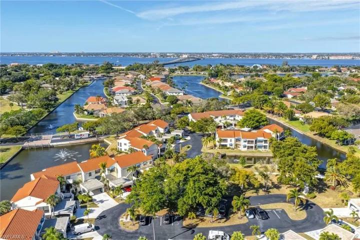 Aerial perspective of suburban area featuring a large body of water