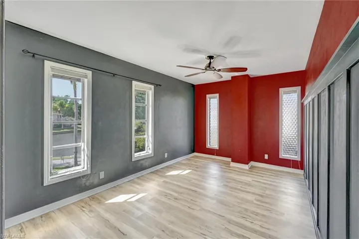 Unfurnished room with light wood-style floors and ceiling fan