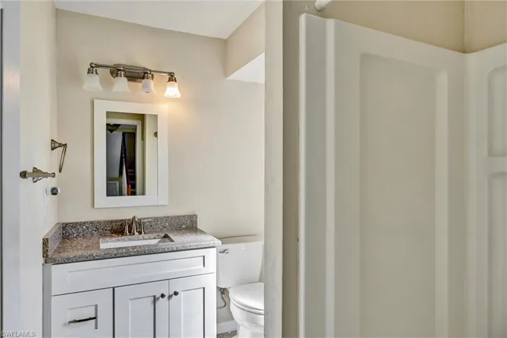 Bathroom with vanity and a shower