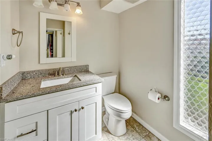 Bathroom featuring vanity and toilet