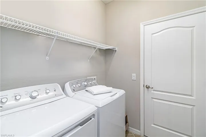 Clothes washing area with washer and clothes dryer