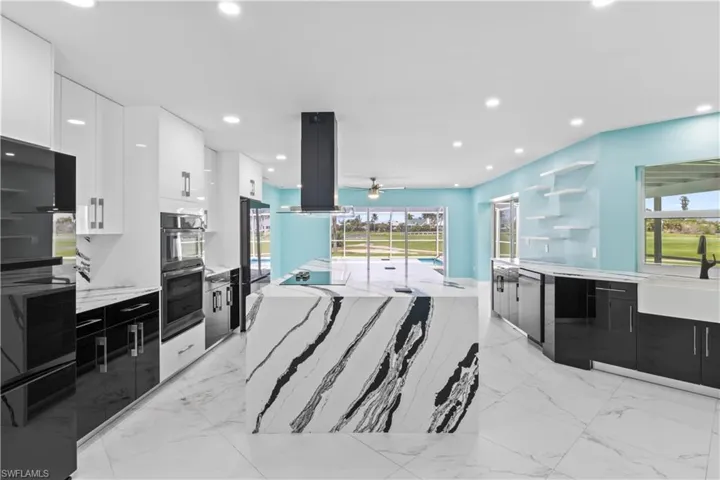 Designer and high end waterfall stone!  Lots of cabinetry and storage as well!