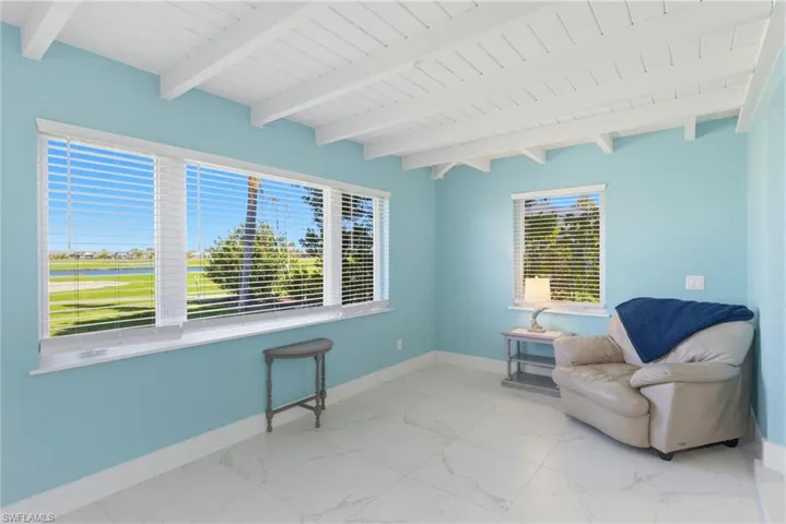 Large walk in shower with multiple showerheads and wheelchair accessible.