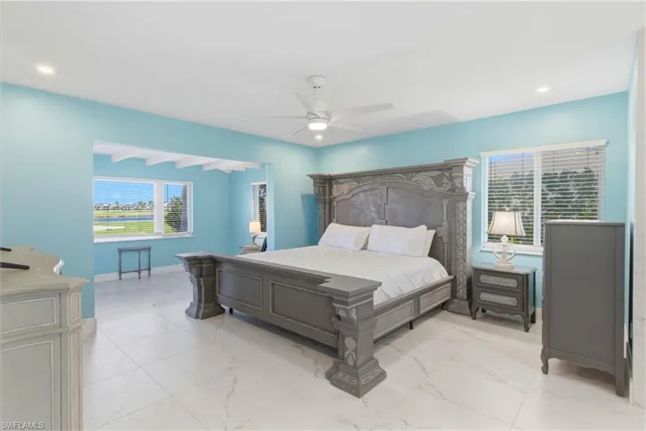 Primary bedroom den with sliders to the outside and beautiful detailed wood ceilings!