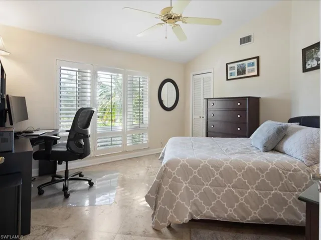 2nd Bedroom with a closet, lofted ceiling, and ceiling fan