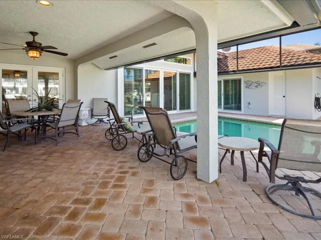 View of patio featuring french doors and ceiling fan
