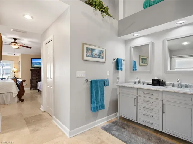 Master Bathroom featuring vanity, tile patterned floors, and ceiling fan
