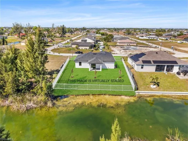 Aerial view with a water view and a residential view