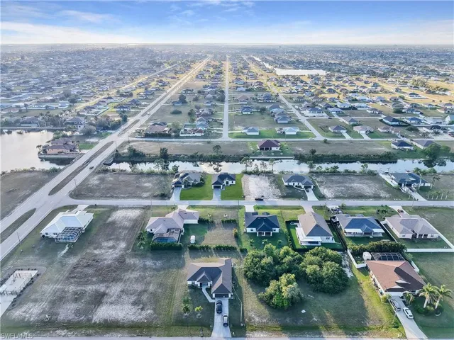 Bird's eye view with a water view and a residential view