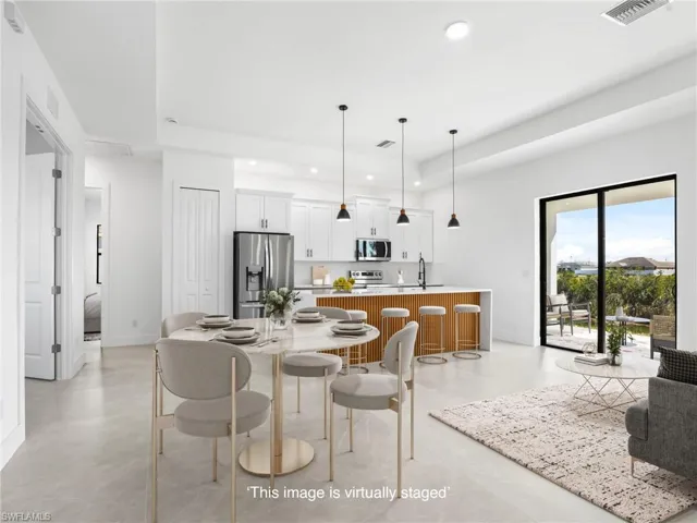 Dining space featuring recessed lighting, visible vents, and baseboards
