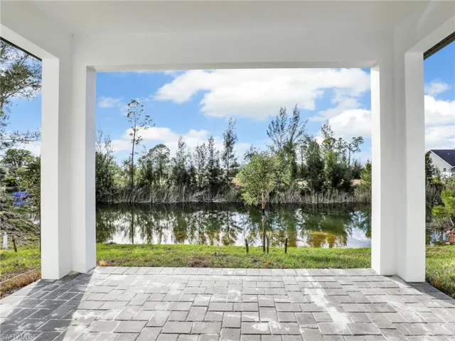View of patio with a water view