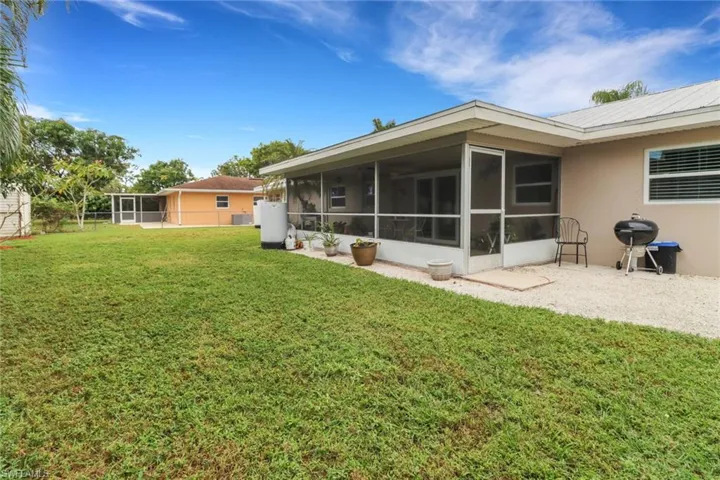 Back of property featuring a patio and a yard and room for a pool