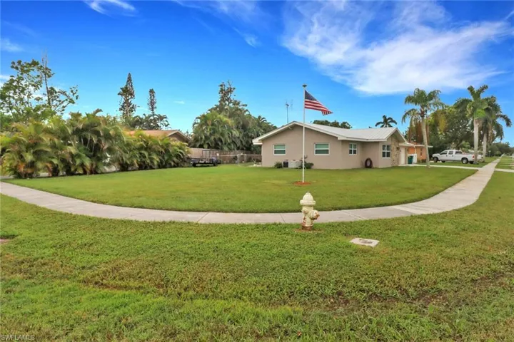 View of home's exterior with a yard